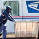 Postal workers prepare mail for delivery at the Kilbourn Park post office on May 09, 2020 in Chicago, Illinois.